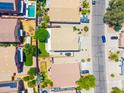 Aerial view of the house showcasing the backyard, landscaping, and surrounding neighborhood at 3511 W Allens Peak Dr, San Tan Valley, AZ 85144