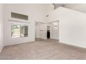 Bright and spacious living room with tall ceilings, neutral paint, and lots of light at 37911 N Luke Ln, San Tan Valley, AZ 85140