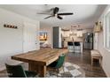 Open floor plan view of a dining room with natural light, leading to the kitchen at 4136 E Eugie Ave, Phoenix, AZ 85032