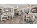 Inviting dining area with hardwood floors, neutral color scheme, and access to living areas at 6247 E Albany St, Mesa, AZ 85205