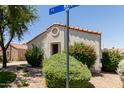 Close up exterior of a home with rock landscaping and bushes at 8628 W Maui Ln, Peoria, AZ 85381