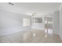 Spacious living room featuring tile floors, crown moulding, and lots of natural light at 9420 S 35Th Gln, Laveen, AZ 85339