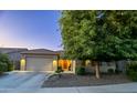 Inviting single-Gathering home exterior with a well-maintained yard and lovely curb appeal at 10440 W Swayback Pass, Peoria, AZ 85383