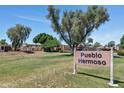 Scenic view of the Pueblo Hermoso community with mature trees and green spaces at 1066 E Pueblo Rd, Phoenix, AZ 85020