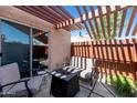 Relaxing patio area with comfortable seating and a modern fire pit feature at 1066 E Pueblo Rd, Phoenix, AZ 85020