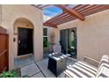 Inviting outdoor patio with pergola, seating, and cozy fire pit for relaxation at 1066 E Pueblo Rd, Phoenix, AZ 85020