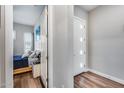 Bright hallway with a view of the bedroom and a contemporary front door with decorative windows at 1202 E Nolan Pl, Chandler, AZ 85249