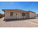 Quaint single-story home featuring desert landscaping for a low-maintenance front yard at 122 N 5Th St, Avondale, AZ 85323