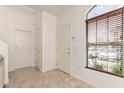 Bright entryway with neutral tile flooring, leading to other rooms at 1350 S Greenfield Rd # 1123, Mesa, AZ 85206