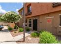 Welcoming front entrance with well-maintained landscaping and desert flora, set in a peaceful neighborhood at 1350 S Greenfield Rd # 1123, Mesa, AZ 85206