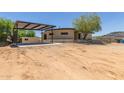 Charming single story home shows carport with stone accents and desert landscaping at 1545 E Christy Dr, Phoenix, AZ 85020