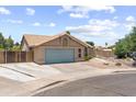 Charming single-story home with a well-maintained front yard, a two-car garage, and a neatly paved driveway on a sunny day at 1672 W Butler Dr, Chandler, AZ 85224
