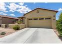 Charming home featuring desert landscaping, covered porch, and a two-car garage at 16756 S 181St Ln, Goodyear, AZ 85338