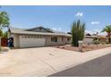 Charming single-story brick home with a two-car garage, and xeriscaping at 2119 E Sesame St, Tempe, AZ 85283