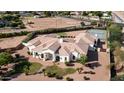 Expansive estate with mature landscaping, tennis court, and pristine architecture at 3126 E Fruitvale Ct, Gilbert, AZ 85297