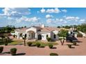 Aesthetic single-story home exhibits beautiful landscaping, masonry, and symmetrical architecture at 3126 E Fruitvale Ct, Gilbert, AZ 85297