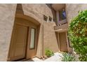 Property shows a welcoming front entrance with two separate front doors and garden details at 3131 E Legacy Dr # 2113, Phoenix, AZ 85042