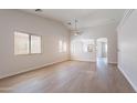 Bright and airy living room with vaulted ceilings and modern flooring throughout at 3313 W Wayland Dr, Phoenix, AZ 85041