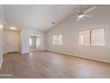Inviting living room showcasing modern floors and an open layout leading to entryway at 3313 W Wayland Dr, Phoenix, AZ 85041
