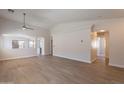 Spacious living room featuring modern wood floors and an open-concept design at 3313 W Wayland Dr, Phoenix, AZ 85041