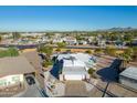 Aerial shot of a residential area with homes and desert landscaping on a clear day at 420 S 80Th Pl, Mesa, AZ 85208
