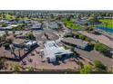 Bird's-eye view of homes nestled around a curve, showcasing their well-kept yards at 420 S 80Th Pl, Mesa, AZ 85208