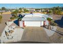 Charming home featuring a white facade, two-car garage, and desert landscaping at 420 S 80Th Pl, Mesa, AZ 85208