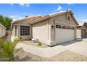 Charming single-story home with a two-car garage and low-maintenance desert landscaping at 4615 W Del Rio St, Chandler, AZ 85226