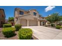A lovely two-story home featuring a spacious three-car garage and well-maintained landscaping at 5208 W Straight Arrow Ln, Phoenix, AZ 85083