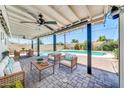 Inviting outdoor patio with comfortable seating, string lights, and a large pool perfect for entertaining and relaxation at 6808 N 11Th St, Phoenix, AZ 85014