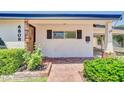 Charming home exterior featuring a red brick pathway, front door, and lush landscaping for a welcoming entrance at 6808 N 11Th St, Phoenix, AZ 85014