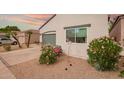 Single-Gathering home featuring desert landscaping and a white stucco exterior at 7031 S 32Nd Pl, Phoenix, AZ 85042