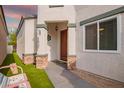 Charming single-Gathering home featuring a covered front porch with stone accents at 7031 S 32Nd Pl, Phoenix, AZ 85042