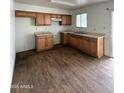 Functional kitchen with wooden cabinets, offering ample storage and counter space at 11802 N 25Th Ave, Phoenix, AZ 85029