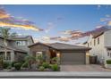 Charming single-story home with a tile roof, brick accents, and a well-manicured front yard at 12152 W Briles Rd, Peoria, AZ 85383