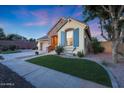Lovely single-story home showcasing a brick accent wall, green lawn, and inviting curb appeal in neighborhood at 13295 N 153Rd Ln, Surprise, AZ 85379