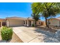 Beautiful single-story home featuring a well-maintained front yard and attached two-car garage at 1356 S Mosley Ct, Chandler, AZ 85286
