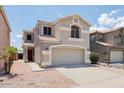 Charming two-story home featuring a neutral color palette, well-maintained landscaping and a two car garage at 1453 E South Fork Dr, Phoenix, AZ 85048