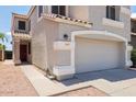Charming two-story home featuring a neutral color palette, well-maintained landscaping and a two car garage at 1453 E South Fork Dr, Phoenix, AZ 85048