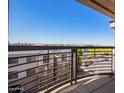 Balcony view overlooking an apartment complex on a bright, clear day at 1701 E Colter St # 491, Phoenix, AZ 85016