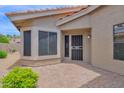 Secluded outdoor brick patio with covered area, great for entertaining and relaxing at 19107 N 94Th Ave, Peoria, AZ 85382