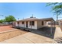 Charming single-story home with covered parking and minimal landscaping at 2721 W Luke Ave, Phoenix, AZ 85017