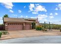 Lovely single-story home boasting a three-car garage, xeriscaping, and an American flag at 2761 W Via Calabria --, Phoenix, AZ 85086