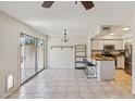 Open-concept kitchen with stainless steel appliances and breakfast bar, adjacent to dining area at 3440 E Southern Ave # 1042, Mesa, AZ 85204