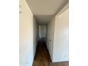 Hallway with white walls and wood look laminate flooring at 3441 W Windrose Dr, Phoenix, AZ 85029