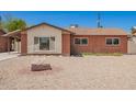Charming single-story brick home with desert landscaping, creating an inviting curb appeal at 3644 W Maryland Ave, Phoenix, AZ 85019
