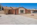 Inviting single-story brick home with desert landscaping and long drive way at 3644 W Maryland Ave, Phoenix, AZ 85019