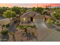 Stunning aerial view of a well-maintained property with desert landscaping and a tile roof at sunset at 4032 S Santa Rita Pl, Chandler, AZ 85249