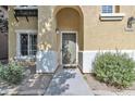 Inviting front entryway with an arched doorway, stone accents, and well-kept landscaping at 4159 E Jasper Dr, Gilbert, AZ 85296