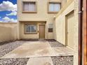 Inviting townhome featuring a private courtyard entrance and desert landscaping for low maintenance at 4416 E Riverside St, Phoenix, AZ 85040